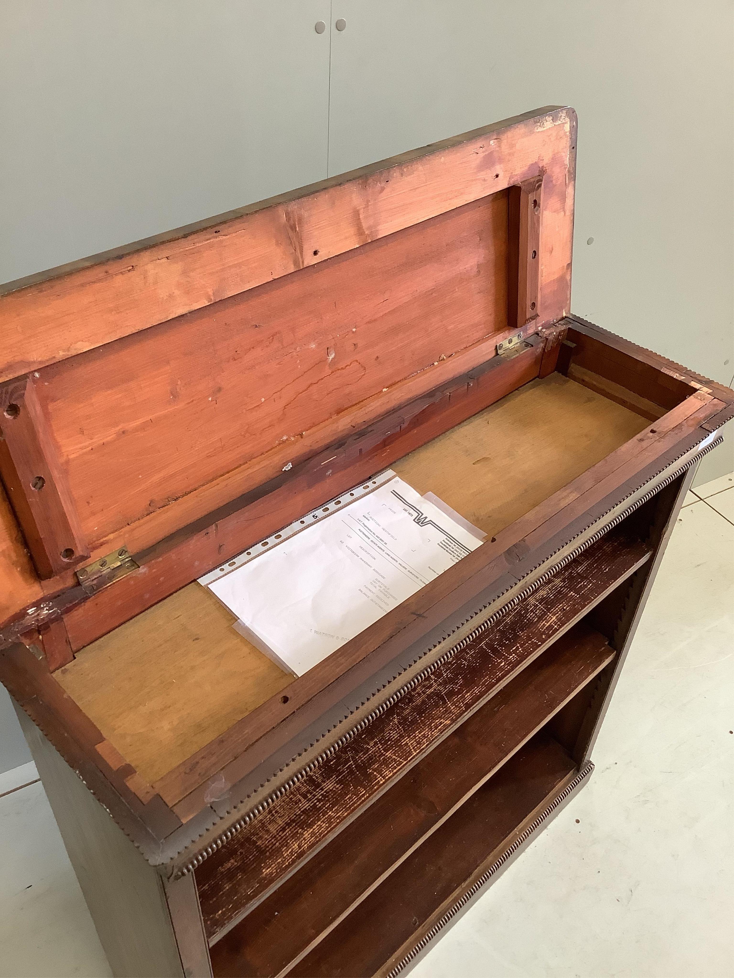 A Victorian mahogany open bookcase, with lift up lid revealing a hidden compartment underneath, width 96cm, depth 31cm, height 102cm. Condition - fair